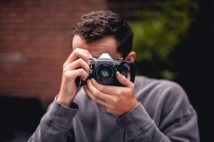 Turning-hobbies-into-income Turning a hobby into income.Young man doing photography